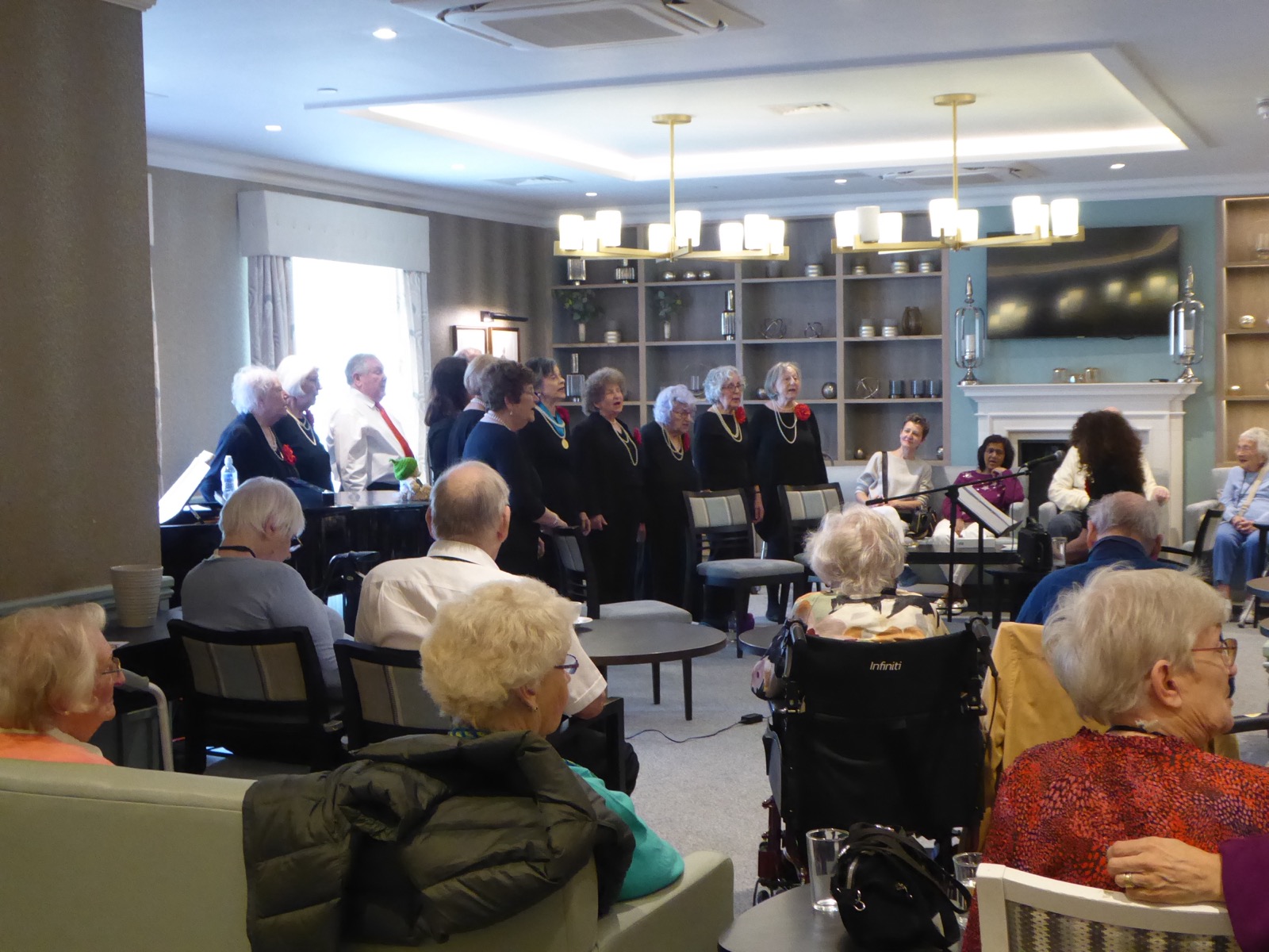 Memory Lane Singers performing for an AgeUK audience.